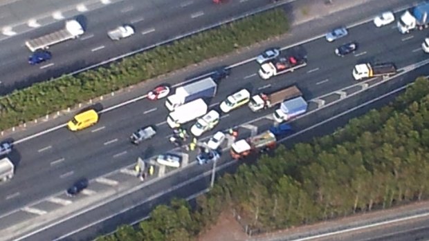 Emergency crews at the scene of a crash on the Pacific Motorway at Beenleigh.