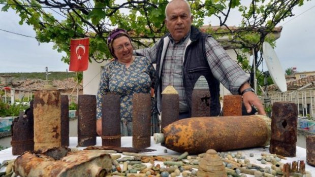 Ali Gul and his wife Gulumser Gul,Turkish farmers display their collection of military artifacts.