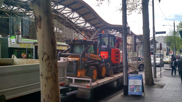 Equipment arrives to dig up Collins Street.