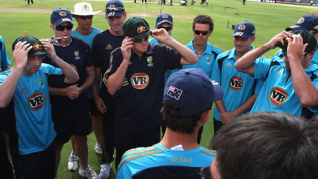 Debutants (L - R) Phil Hughes, Marcus North and Ben Hilfenhaus of Australia try on their baggy greens.