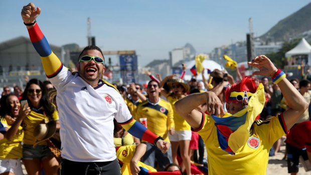Passionate football lovers ... Colombian fans react as their team scores a goal against Greece.