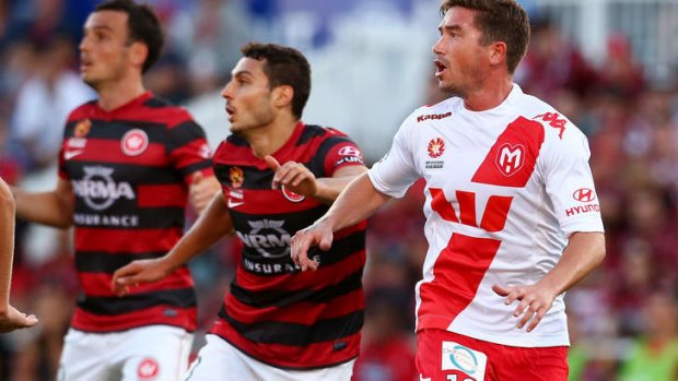 Heart and soul: Harry Kewell in action against Western Sydney Wanderers.