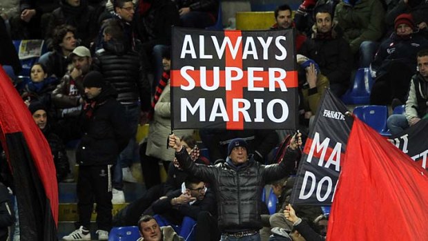 AC Milan supporters welcome Mario Balotelli.