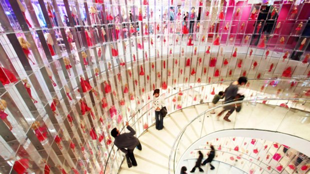Tickled pink ... Shanghai's Barbie store, the biggest in the world. A three-storey spiral staircase featuring 875 dolls in hand-sewn clothes is the store's centrepiece.