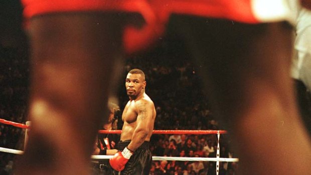 Mike Tyson looks across the ring at Frank Bruno ahead of their fight in March 1986.