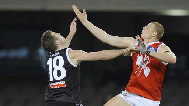 Up and away: Orren Stephenson (left) in action with North Ballarat.