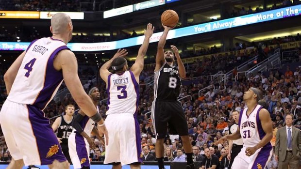 Patty Mills puts up a shot against the Suns.