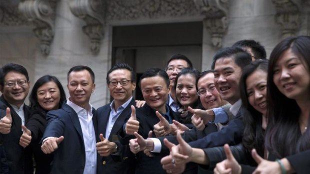 Jack Ma (centre) with Alibaba employees at the New York Stock Exchange.