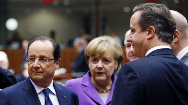 Seeking bilateral talks: Francois Hollande, Angela Merkel and David Cameron at the European Union leaders summit.