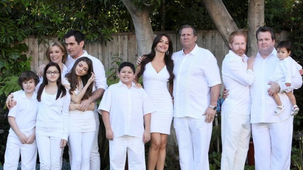 The cast of American sitcom <i>Modern Family</i>, starring Jesse Tyler and Eric Stonestreet (far right) attempts to depict the reality of a large family with a little sentimentality and plenty of humour.