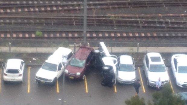 Cars overturned in a Hornsby car park after the storm cell went through.