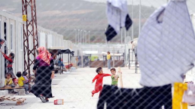 Syrian refugees at the Oncupinar refugee camp in Kilis near the Syrian border ... there are reports that Syria’s army opened fire in some parts of the country in violation of the ceasefire.