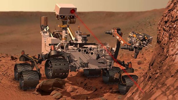 An artist's impression of Curiosity at work on Mars.