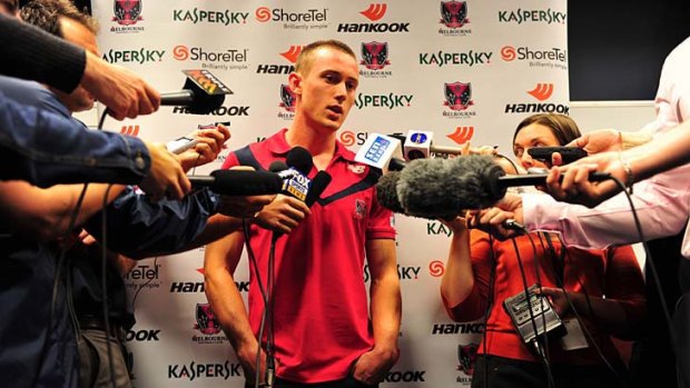 Young gun: Melbourne's Tom Scully tells a packed media conference he wants to be a one-club player but would also consider a lucrative offer from the Giants.