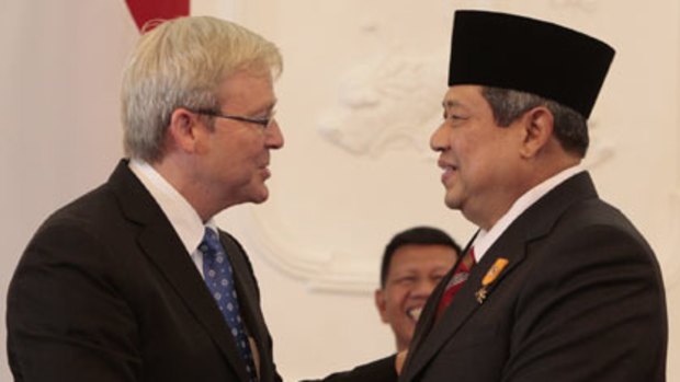 Happy outcome ... Kevin Rudd with Susilo Bambang Yudhoyono at the presidential palace in Jakarta yesterday.