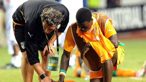 An Ivory Coast player lies distraught after the favourites lost 8-7 on penalties, prolonging their 20-year wait for a second title.