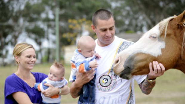 Horsing around... Melanie and Bruce Ponting, who met on a dating website, with their twin sons, Lachlan (left) and Joshua.