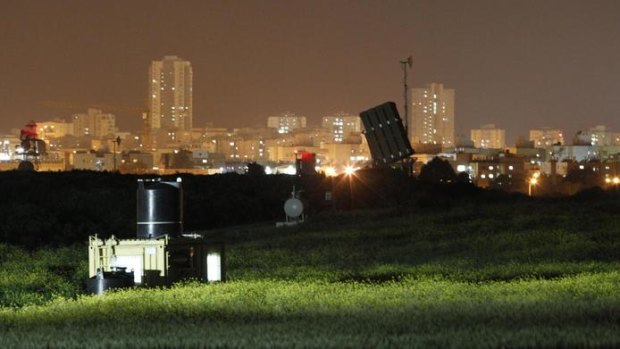 A launcher, part of the Iron Dome rocket shield system, is deployed in a field near the southern Israeli city of Ashdod on Saturday.