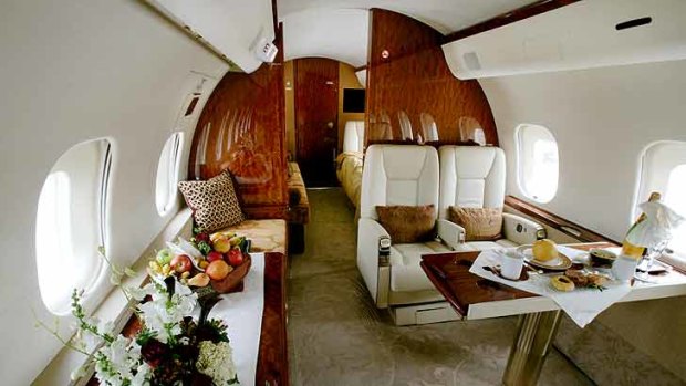 Inside a Bombadier corporate jet, where the furnishings can include seating, eating and sleeping facilities.