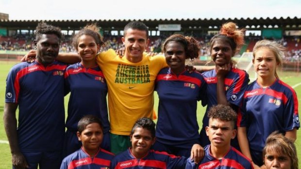 Socceroo Tim Cahill with young Australian Indigenous footballers from the John Moriarty Football team from Borroloola.