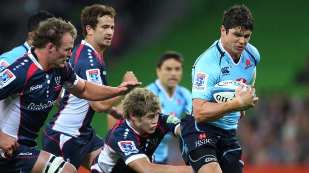 No certainty &#8230; Tom Carter evades James O'Connor during the Waratahs' victory over the Rebels on Friday. The back faces competition to retain his place from Berrick Barnes.