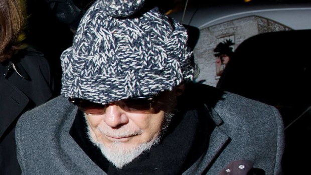 Questions ... Gary Glitter returns home in central London on Sunday  after he was arrested earlier in the day by British police as they probe the mountain of sexual abuse allegations against the late TV star Jimmy Savile.