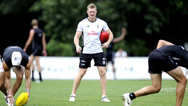 In control: Nathan Buckley oversees Collingwood training yesterday.