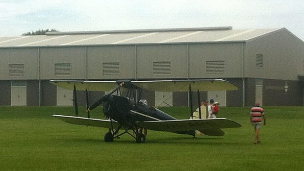 A bi-plane which made an emergency landing at Currimundi State School this morning.