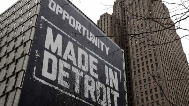 A large "Opportunity Made In Detroit" banner is seen on the side of a building in downtown Detroit, Michigan. The city has filed for bankruptcy.