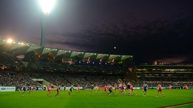 Simonds Stadium hosts a match under lights last week between Geelong and Sydney.