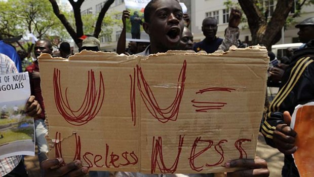 Sign of frustration ... a demonstrator makes his feelings clear in front of the UN headquarters in Pretoria.