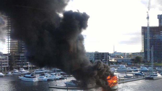 The boat on fire at Docklands.