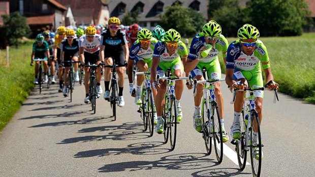 The  Liquigas-Cannondale train ramps up the pace at the front of the peloton.