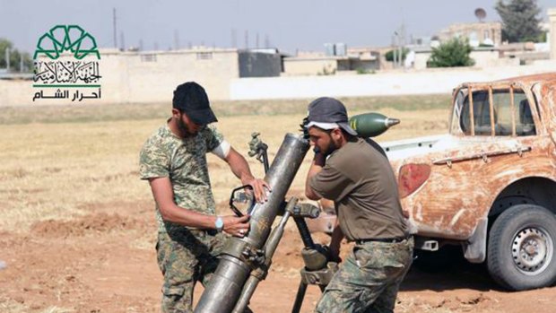 Rebel fighters from Ahrar al-Sham prepare an attack on Islamic State in Aleppo.