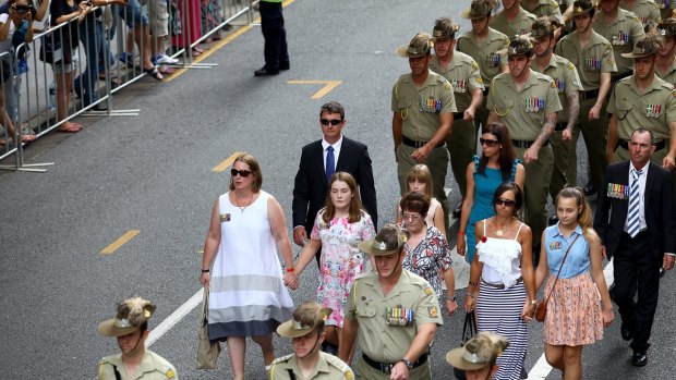 BRISBANE, AUSTRALIA - MARCH 21:  Crowds watch almost 3000 veterans and families and loved ones of veterans from Operation Slipper march through Brisbane's CBD on Saturday March 21, 2015 in Brisbane, Australia.  (Photo by Michelle Smith/Fairfax Media)