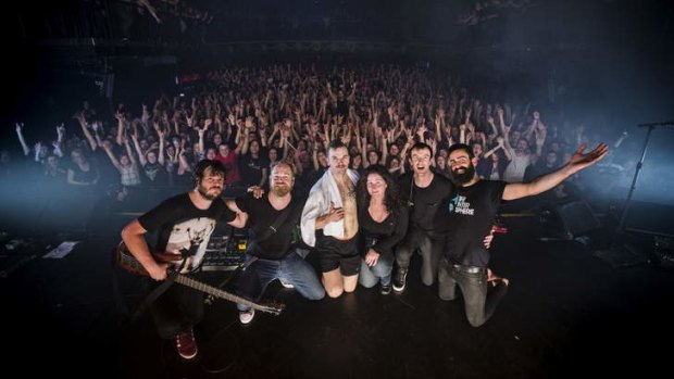 Palace booker Jenny McEwan, with rockers Karnivool.