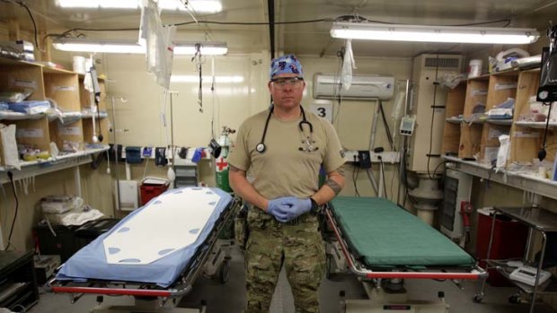 Ready for any emergency: Lieutenant Clint Grose in the Tarin Kowt medical facility during a rare quiet moment.