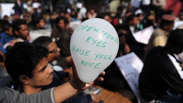 Open your eyes ... protesters in New Delhi.