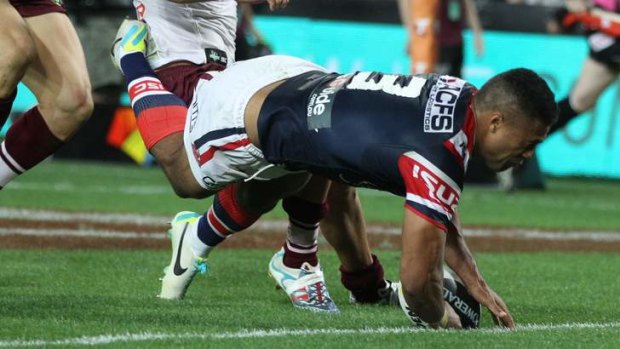 Miracle try: Michael Jennings of the Roosters seals the grand final win over the Sea Eagles.