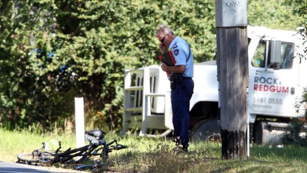 Tragic deaths: police investigate the accident near Merricks on the Mornington Peninsula in which two people riding a tandem bicycle were killed.