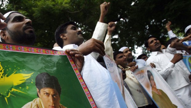 Fury in India ... the members of Akhil Bhartiya Muslim Yuva Atankwad Virodhi Samiti (ABMYAVS) or All India Muslim Youth Anti-Terrorist Group, carry posters of Indian Bollywood star Shah Rukh Khan during a protest against the US in New Delhi.