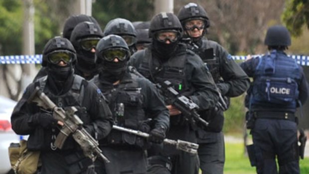 Heavily armed police outside the Chaouk house after the shooting.