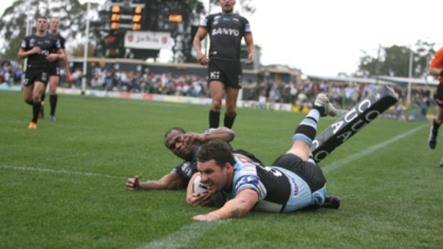 Happy days ... Seymour scores for Cronulla against Penrith