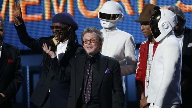 Producer Paul Williams accepts the award for Album of the year for Daft Punk's <i>Random Access Memories </i>as Nile Rodgers (left) and Pharrell Williams look on.