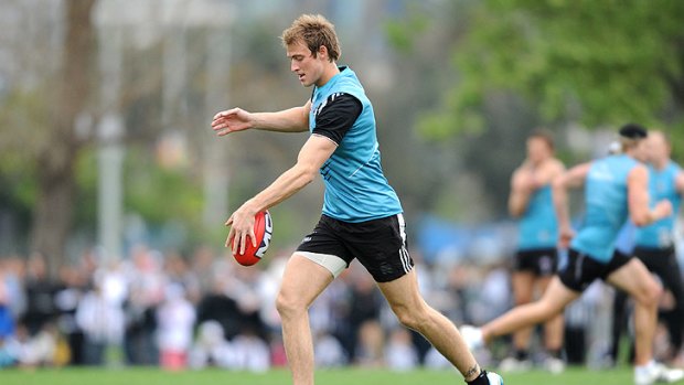 Looking positive: Injured Ben Reid at Collingwood’s training session yesterday.