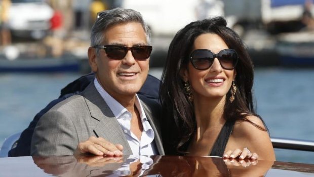 Big event: George Clooney and his Lebanon-born British fiancee Amal Alamuddin take a taxiboat in Venice.