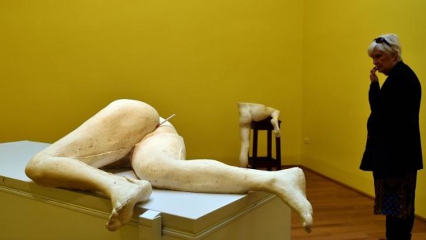 A visitor looks at a creation by British artist Sarah Lucas at the pavilion of Great Britain.