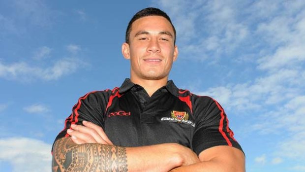 All Black and red ...  Sonny Bill Williams at a news conference on the Gold Coast yesterday to confirm his signing with Canterbury and the Crusaders for two years.