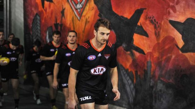 Essendon captain Jobe Watson with teammates before last week's match with North Melbourne.