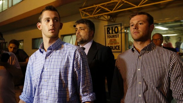 American swimmers Gunnar Bentz, left, and Jack Conger leave a Rio police station after questioning on Thursday. 